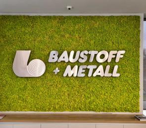 Green wall with corporate logo